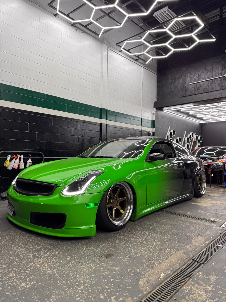 Technicians working on vehicles for remote starter and electronics installations